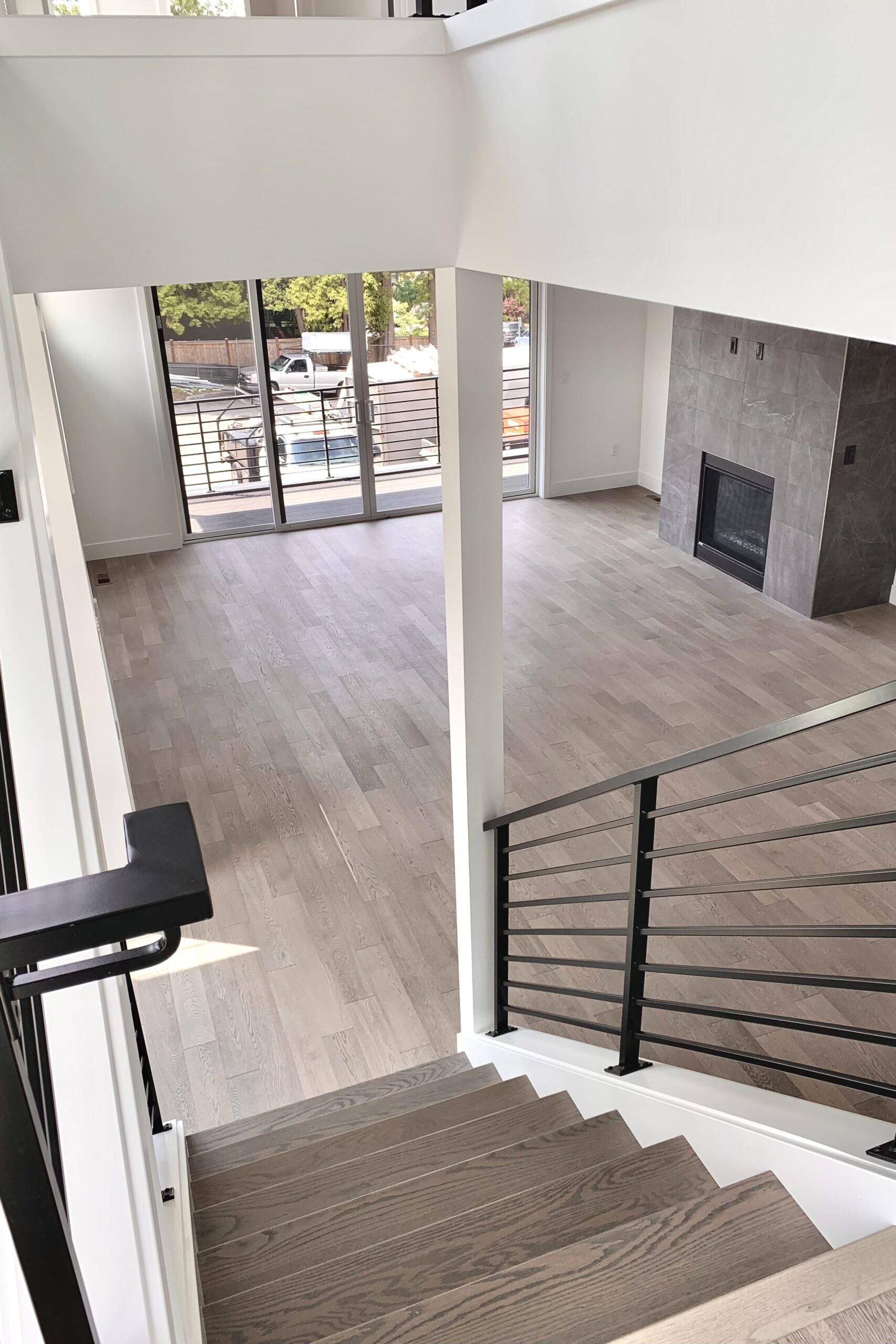 Bright living room remodeled by ArtBrick, your home remodeling Seattle expert, with custom lighting and modern finishes.