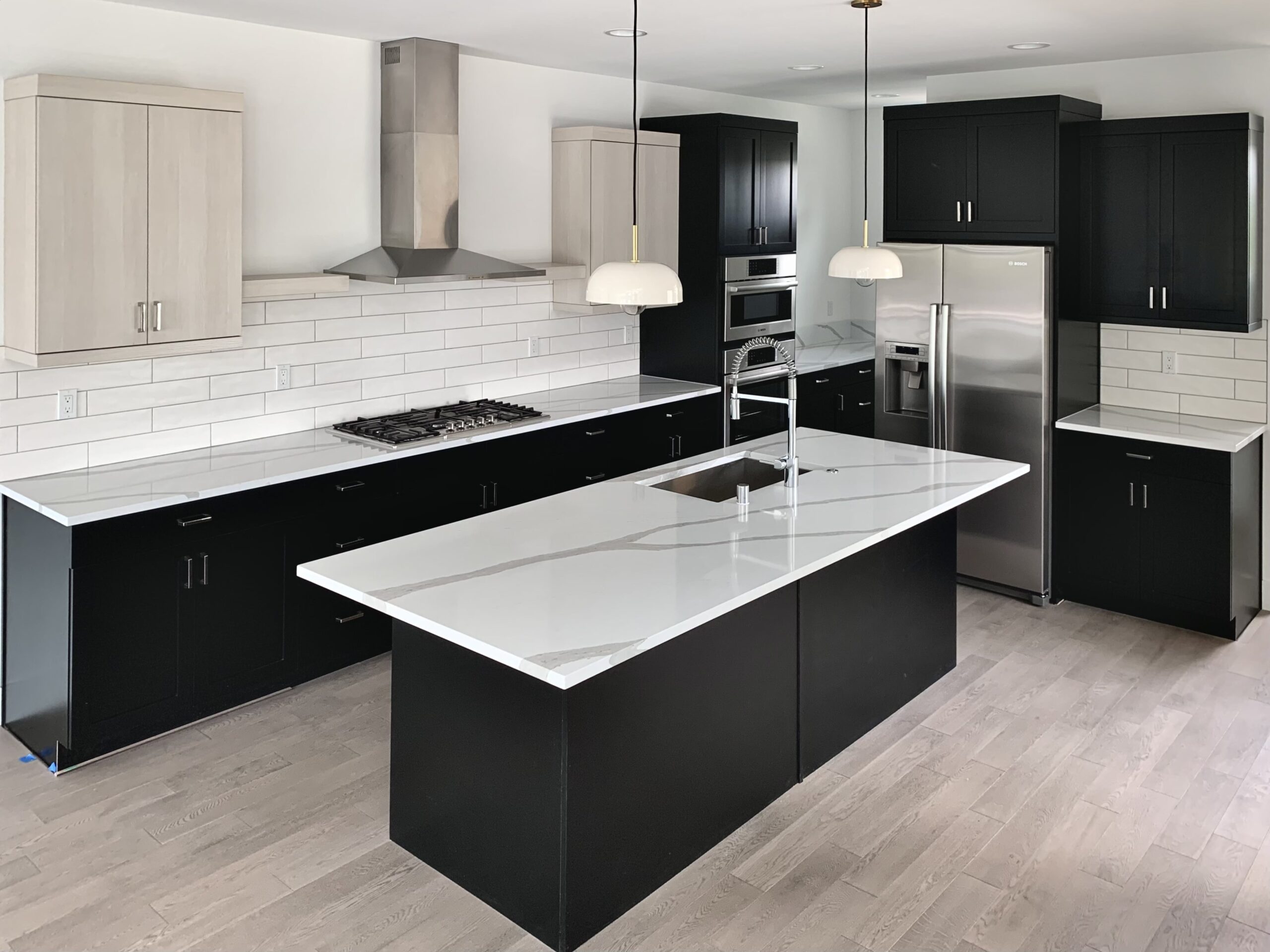 Finished kitchen remodel with island and custom cabinetry by Artbrick
