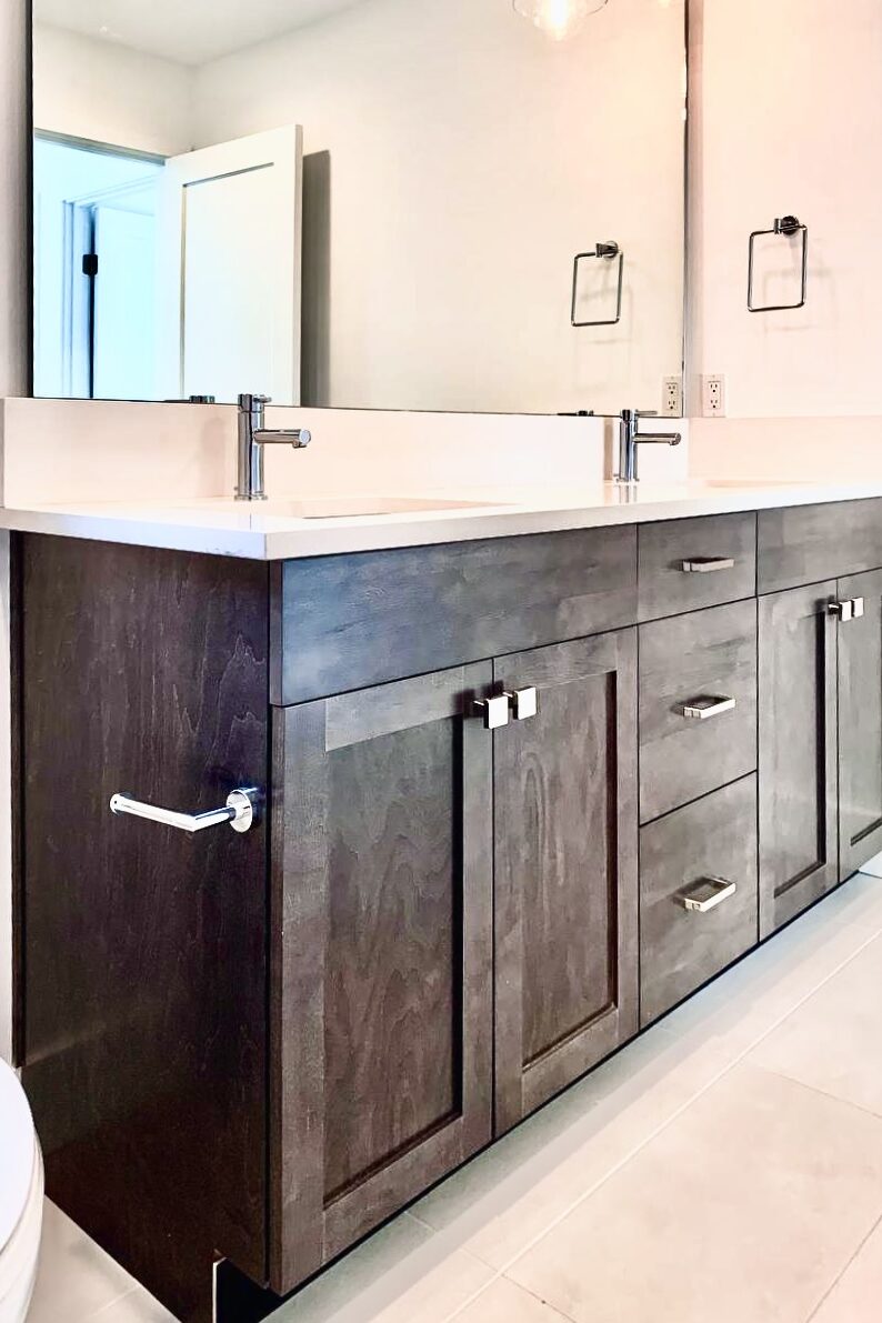 A beautifully updated bathroom showcasing a recent bathroom renovation Seattle project, featuring a modern vanity, and stylish tile work