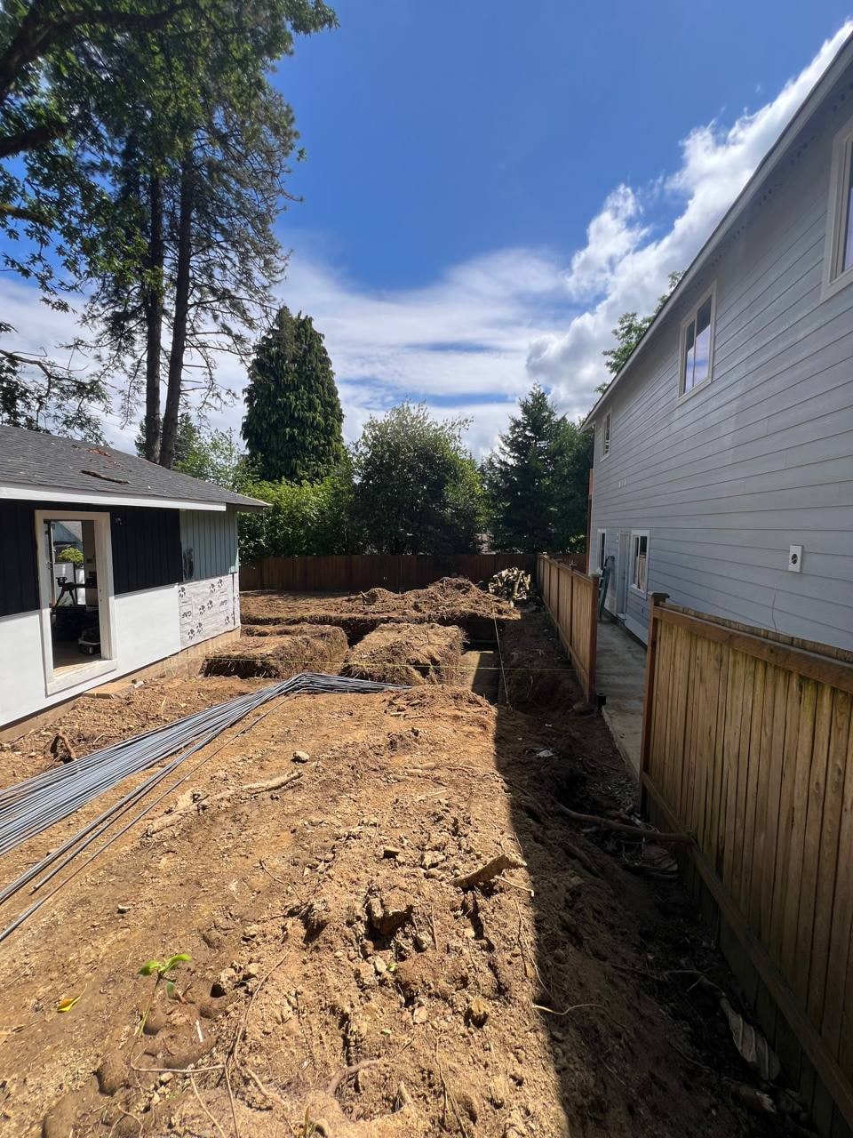 ADU site preparation between existing homes by Artbrick