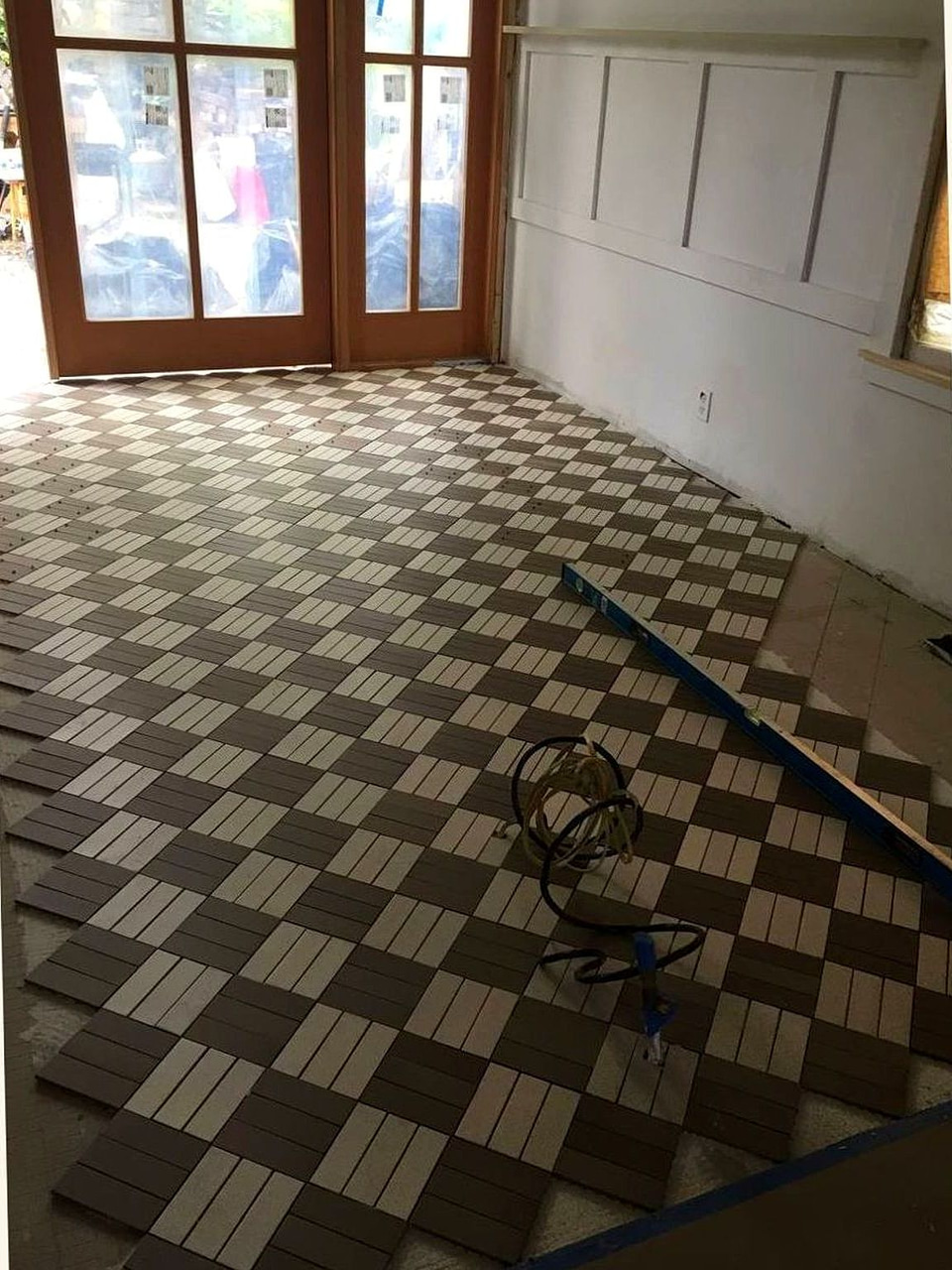 Checkered tile floor installation by Artbrick