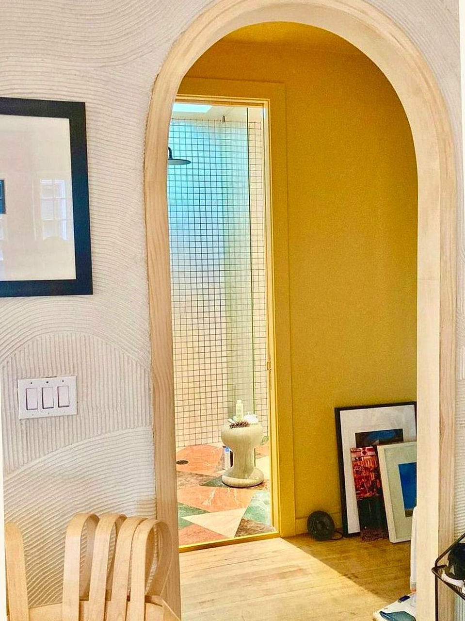 Decorative plaster wall with custom archway by Artbrick