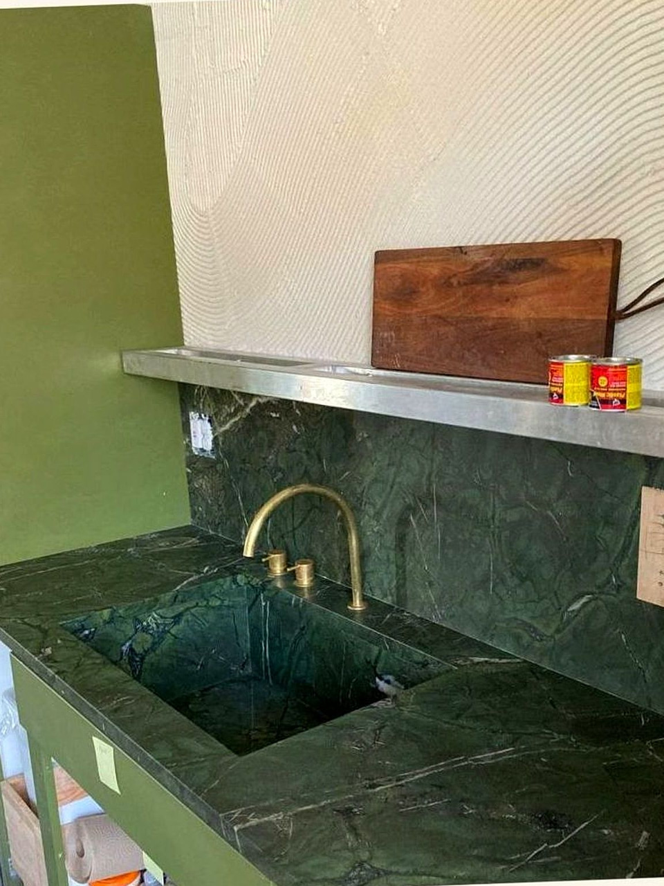 Green marble kitchen sink with brass faucet by Artbrick