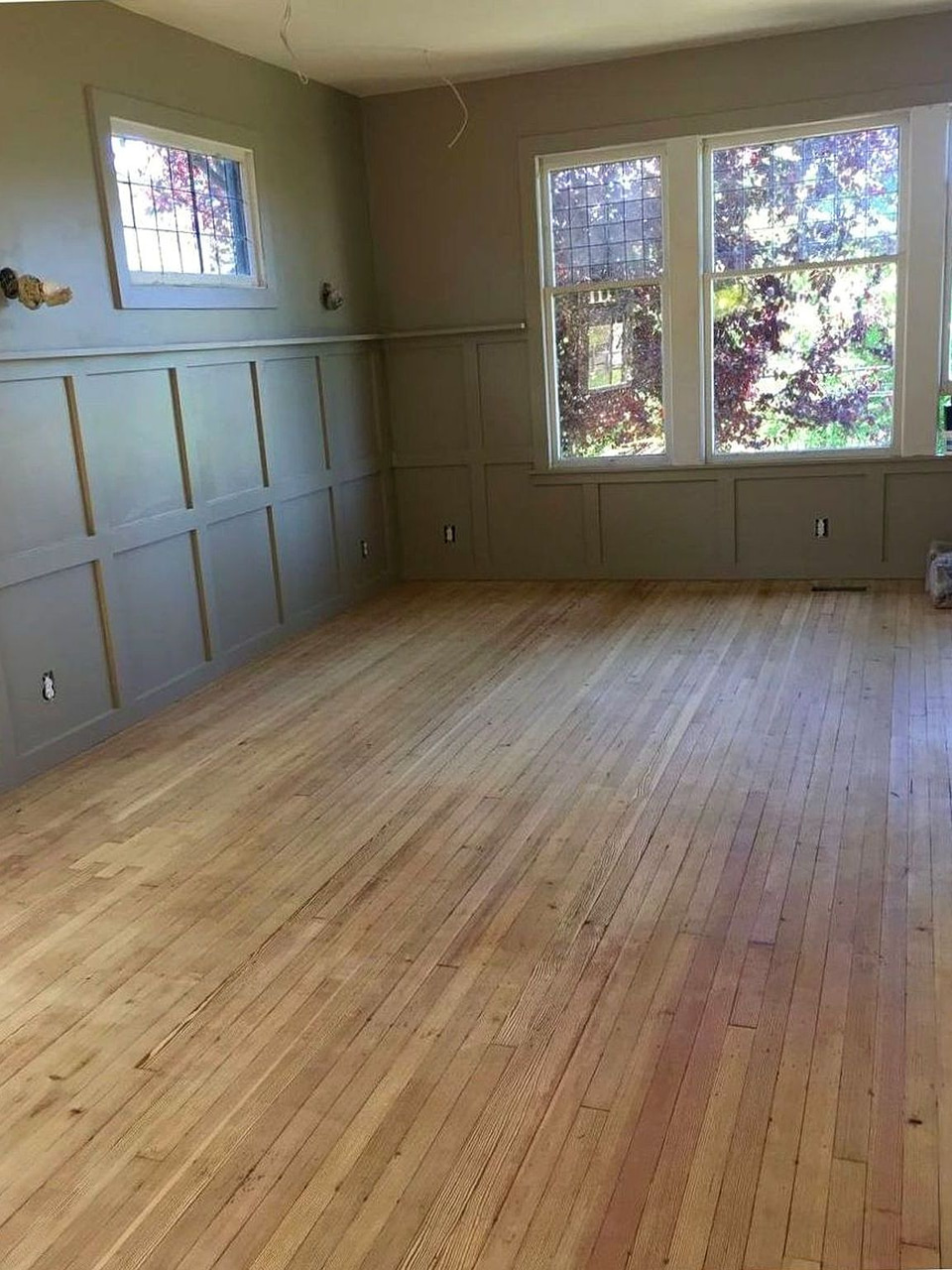 Hardwood flooring and board-and-batten wainscoting by Artbrick