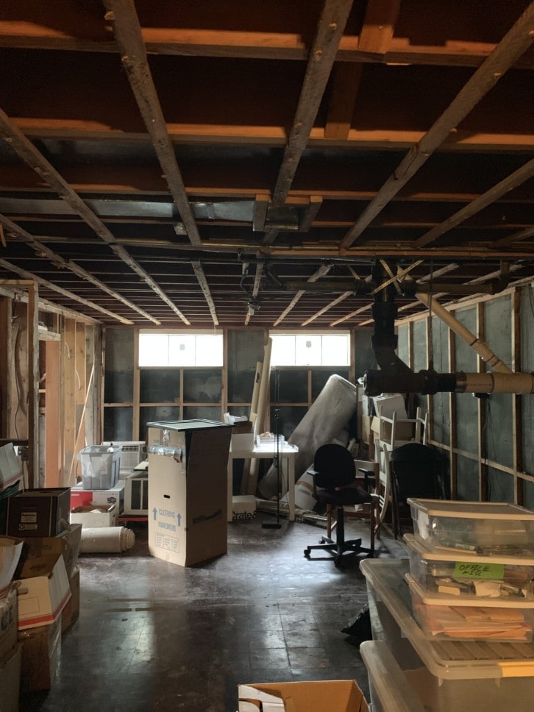 Interior space stripped to framing and cleared for remodel prep by Artbrick