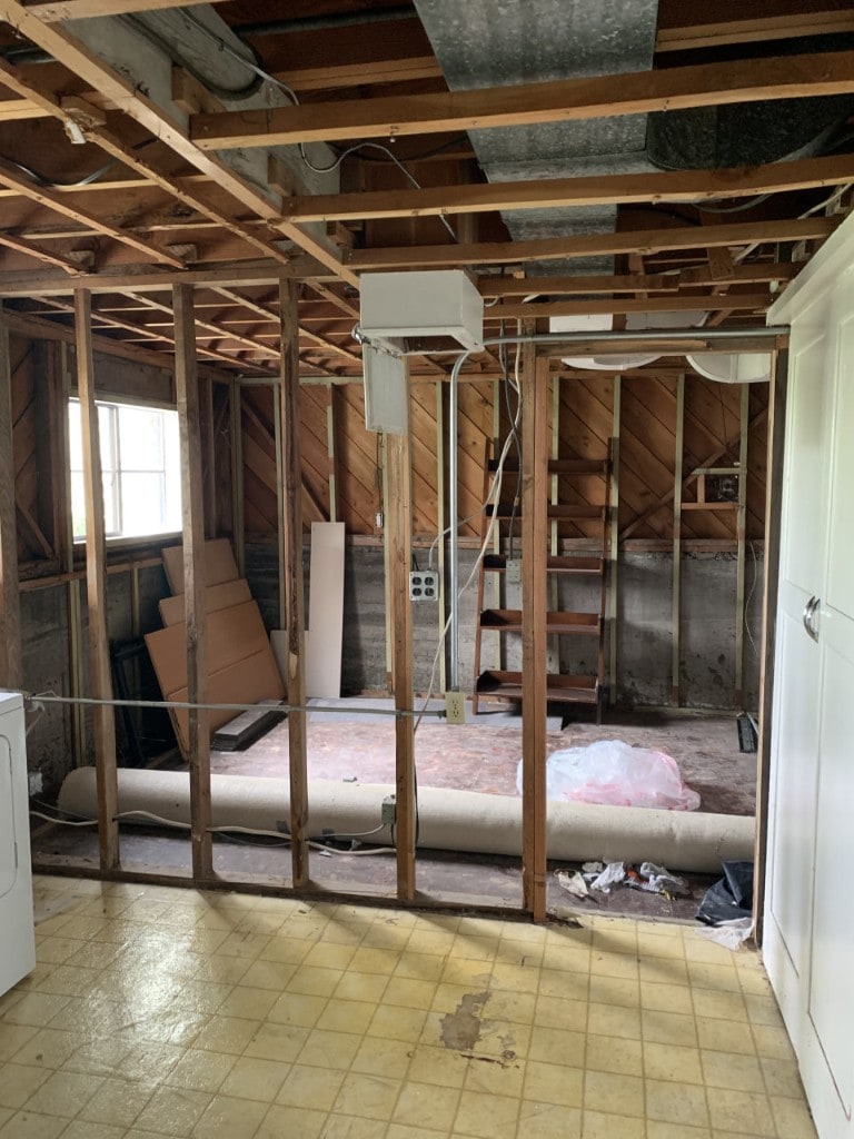 Room stripped to framing with ductwork exposed during demolition by Artbrick
