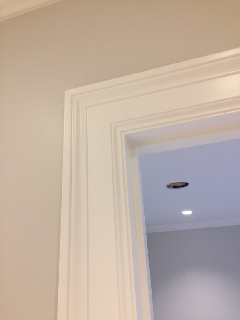 Close-up of crisp interior door casing and trim work by Artbrick