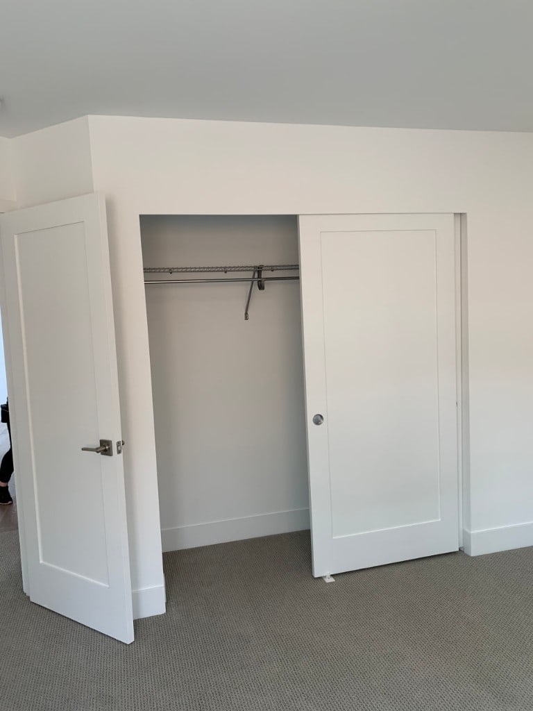 Painted closet interior with crisp white walls and trim by Artbrick