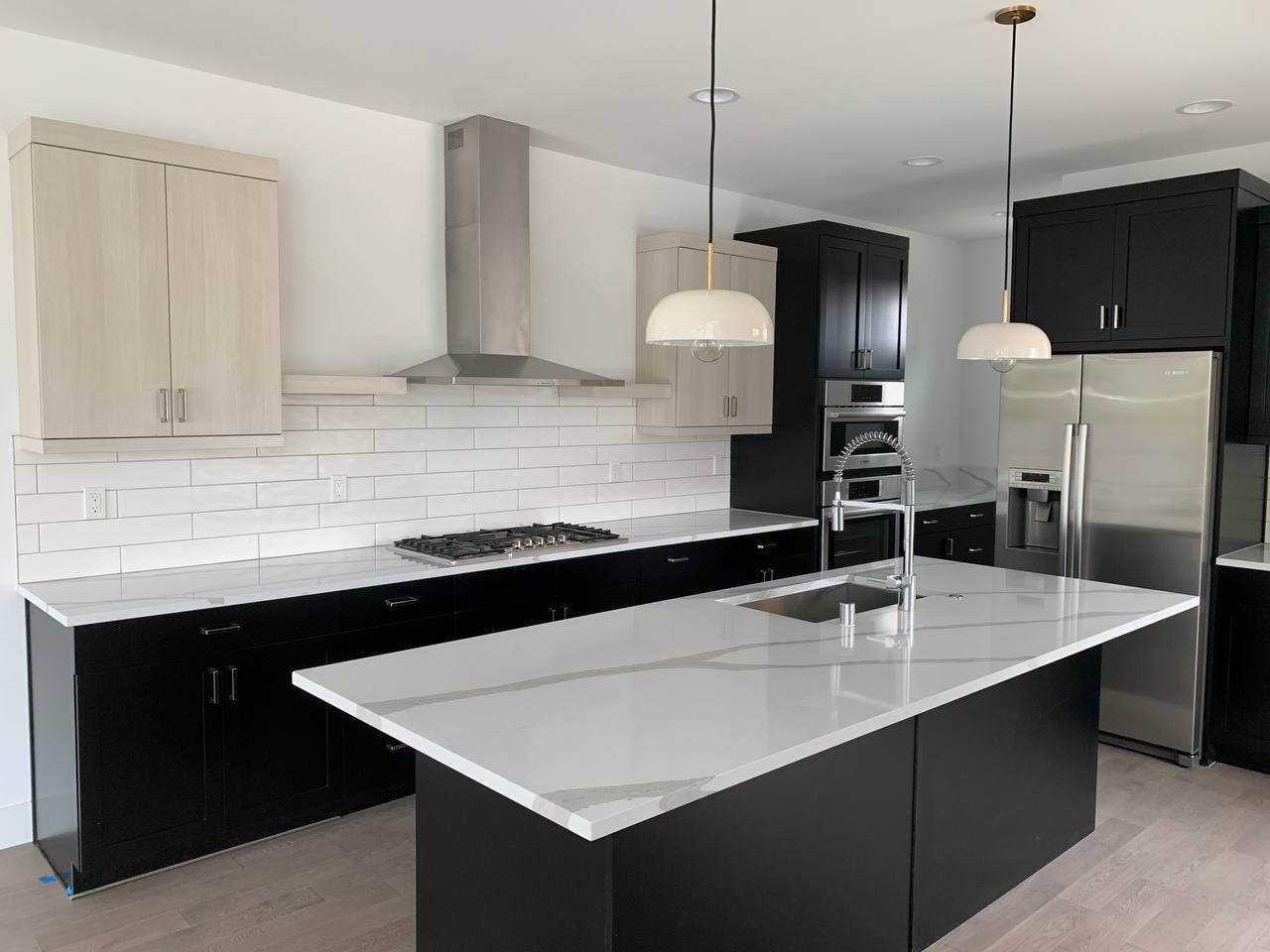 Modern kitchen island in new interior construction by Artbrick